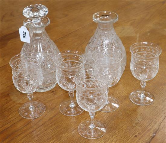 A set of five Stourbridge cut glass wine glasses and a pair of decanters, one lacking a stopper (3)